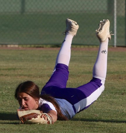 Lemoore's Madison Martinez makes a diving catch Tuesday to end the fourth inning of a 10-2 playoff victory over visiting Santa Maria.